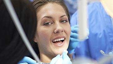 Woman receiving dental exam