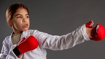 Child wearing a mouthguard