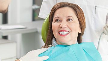 Older woman smiling in dental chair