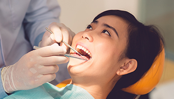 Woman receiving dental exam