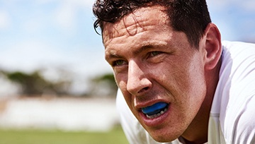 Male teenager wearing a mouthguard