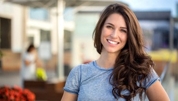 a woman smiling after undergoing cosmetic dentistry in Ann Arbor