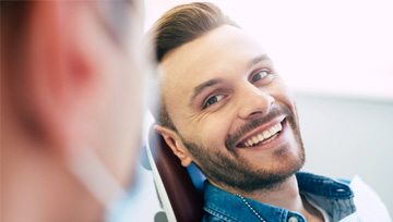 a patient smiling after undergoing cosmetic dentistry in Ann Arbor