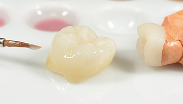 Custom dental crown on a table