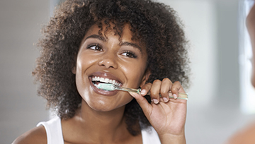 Woman brushing teeth