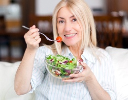 Woman smiling with dental implants in Ann Arbor