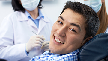 Smiling man in dental chair