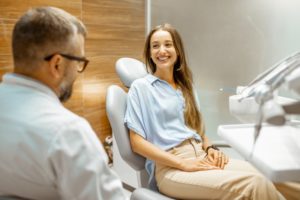 woman talking to dentist