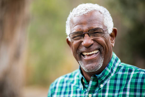 person with a dental bridge smiling