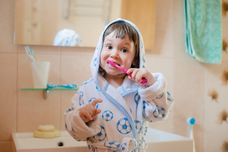 child brushing their teeth at home