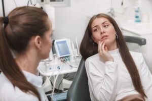 Woman at dentist with dental emergency