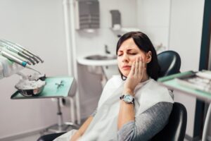 Woman with facial pain at her dentist