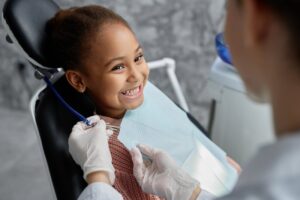 Child smiling at the dentist